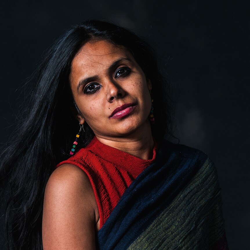 Portrait of Reema Kandasamy with black background