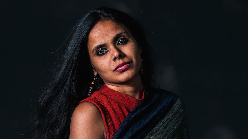 Portrait of Reema Kandasamy with black background