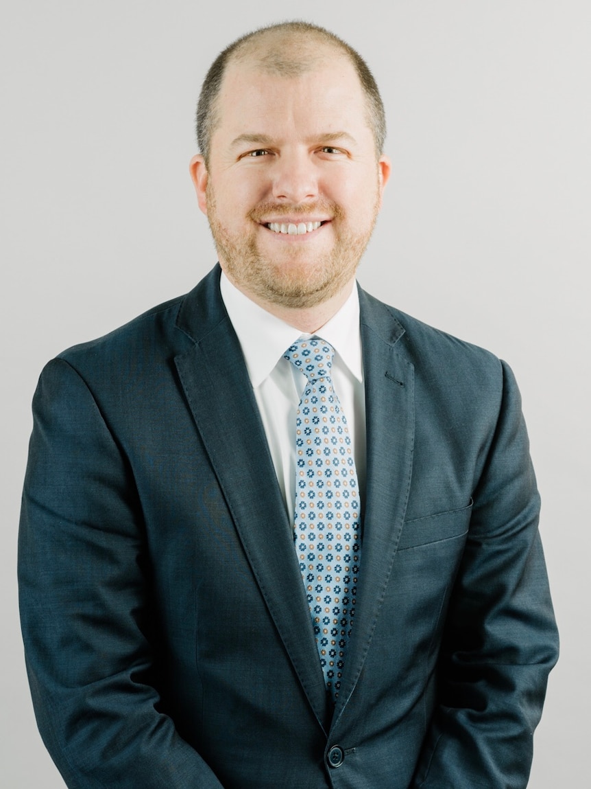 A man wearing a suit and tie.