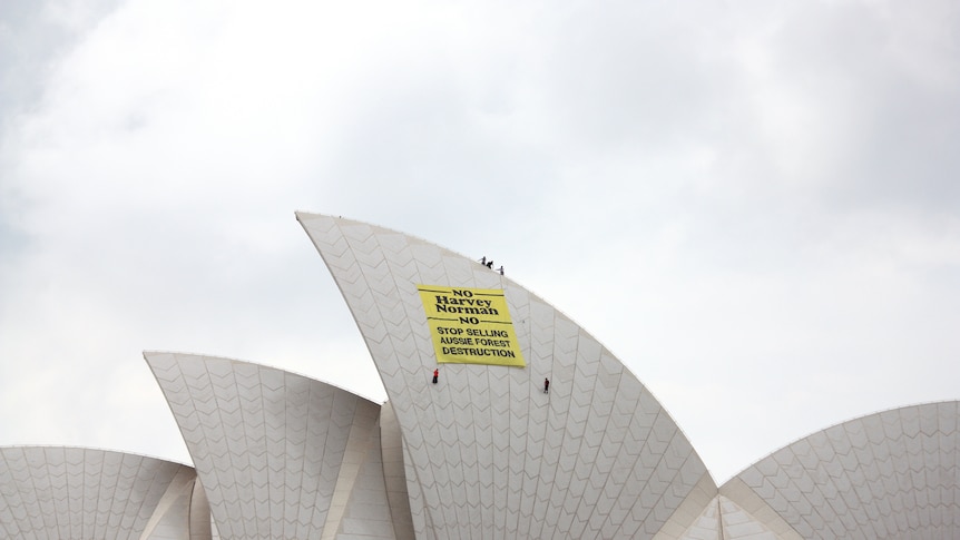 Protesters scale the Sydney Opera House
