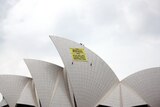 Protesters scale the Sydney Opera House