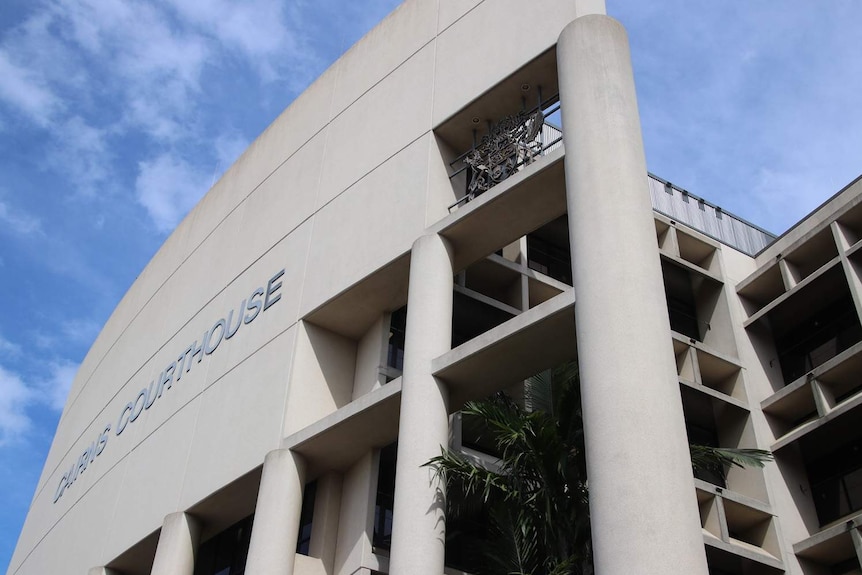 The exterior of a concrete-coloured court building.