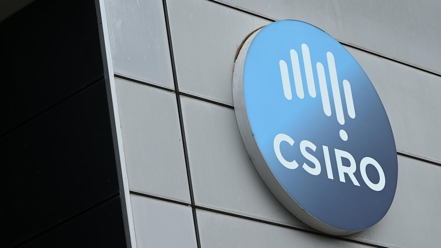 A large circular CSIRO logo on the side of a building.