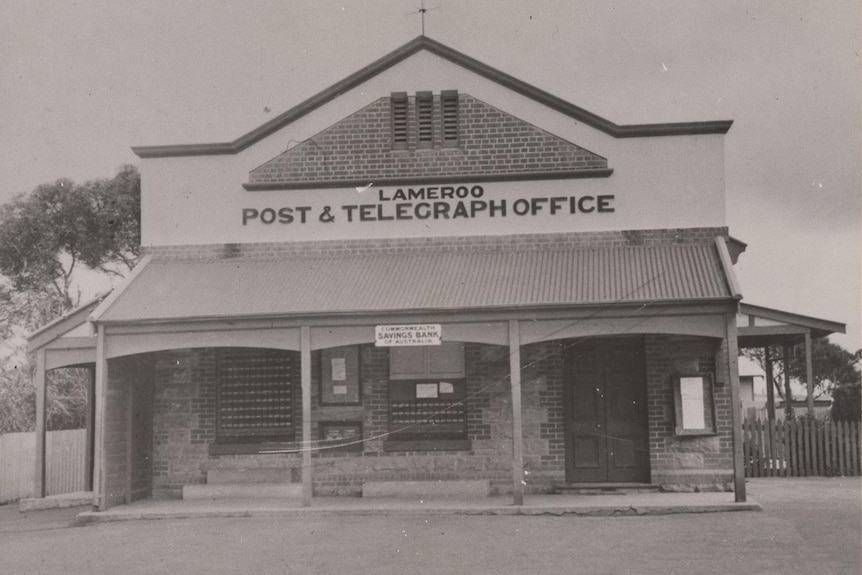 A black and white photo of an older building.