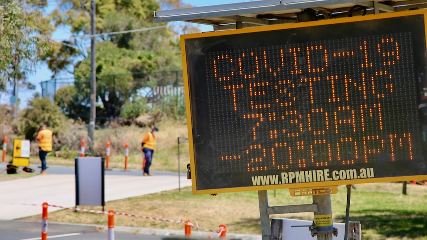 A COVID-19 testing centre sign.