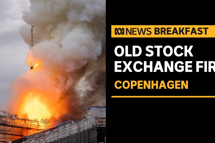 Copenhagen Fire, Historic Building: Flames and smoke billow out of a building covered in scaffolding. 