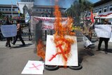 Anti-communism group burns a communist symbol