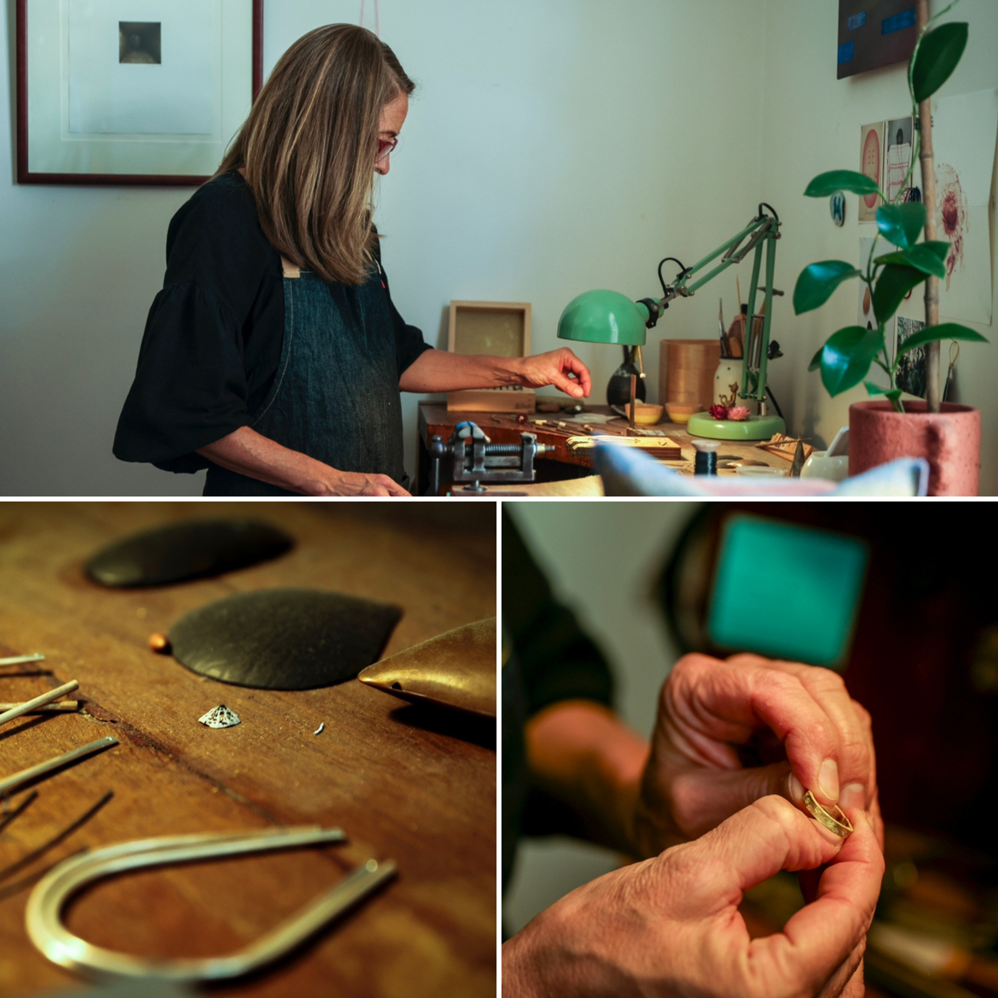 A woman with long brown hair works on jewellery under a lamp at a desk