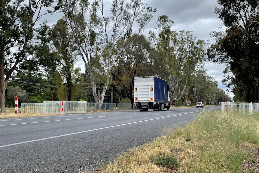A truck going down a highway