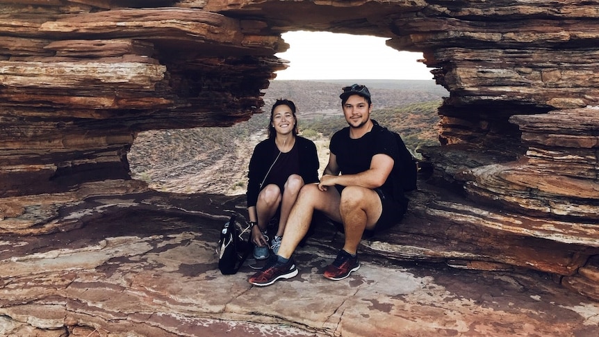 Jackie and Aiden Fraser sit within Kalbarri's Nature's Window as they embark on a year-long-trip around the country.