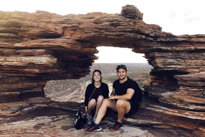 Jackie and Aidan Fraser sit within Kalbarri's Nature's Window as they embark on a year-long-trip around the country.