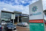 A sign that says Goulburn Valley health in front of an entrance to a hospital