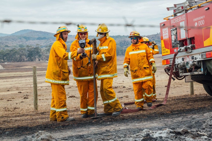 THE CFA crew check the TIC camera reading and prepare the hoses.