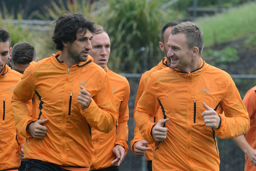 Thomas Broich and Besart Berisha talk to eachother as they jog.