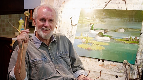 William Cooper at the easel in his home in far north Queensland in 2014.