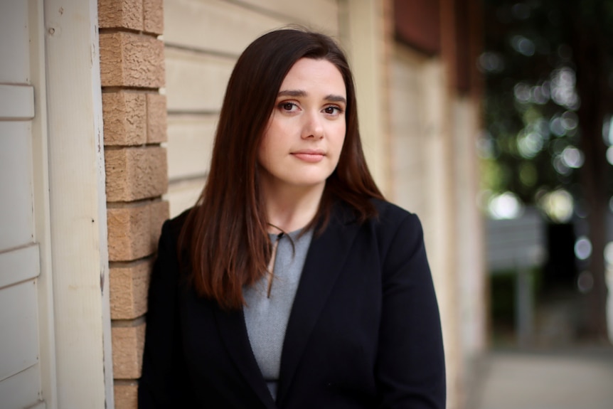 CoreLogic's head of research Eliza Owen stands outside on a street.