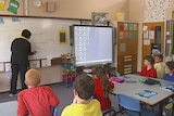 An ACT teacher teaches children in a classroom, good generic. Taken April 03, 2013.