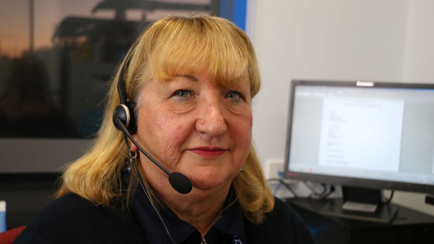 Mental health nurse Glynis Thorp has her headset on for talking to patients over the phone
