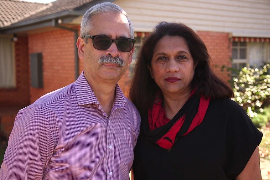 Jayant and Reva outside their house