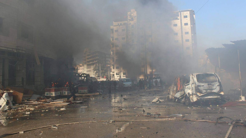 The aftermath of the bombs near the Shiite shrine.