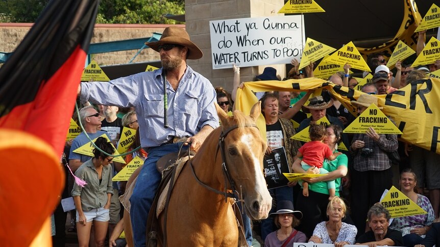 Big River Station owner Daniel Tapp at the protest on horseback