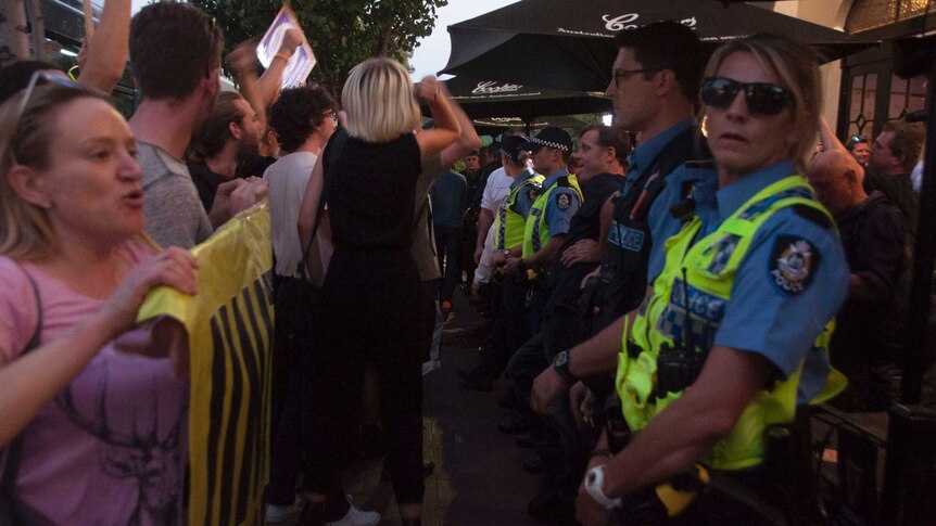 Police and protesters outside a Pauline Hanson event