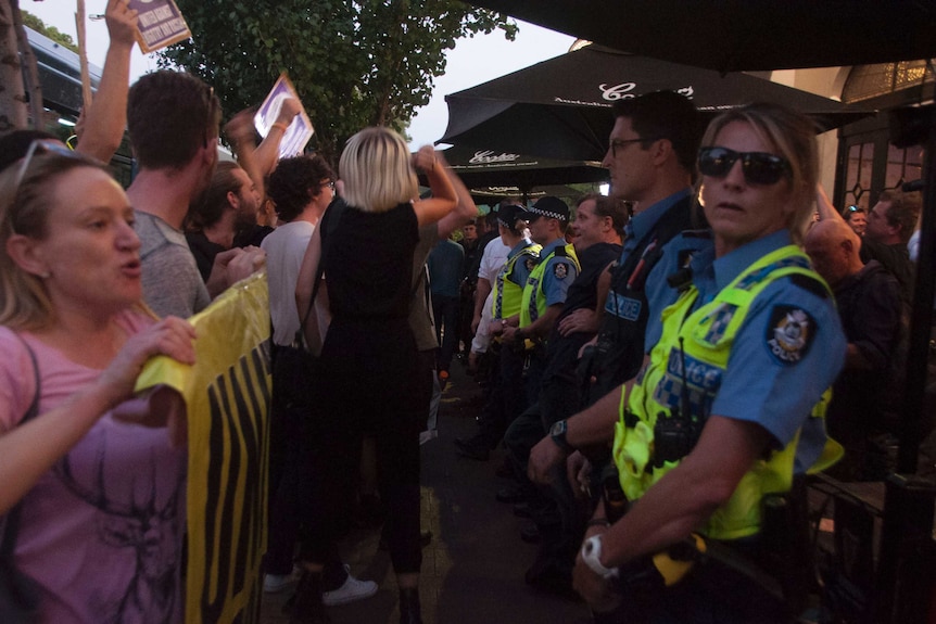 Police and protesters outside a Pauline Hanson event