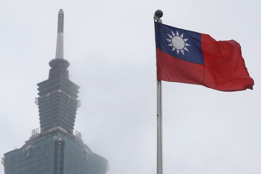 A Taiwan national flag flutters near the Taipei 101 building at the National Dr Sun Yat-Sen Memorial Hall in Taipei