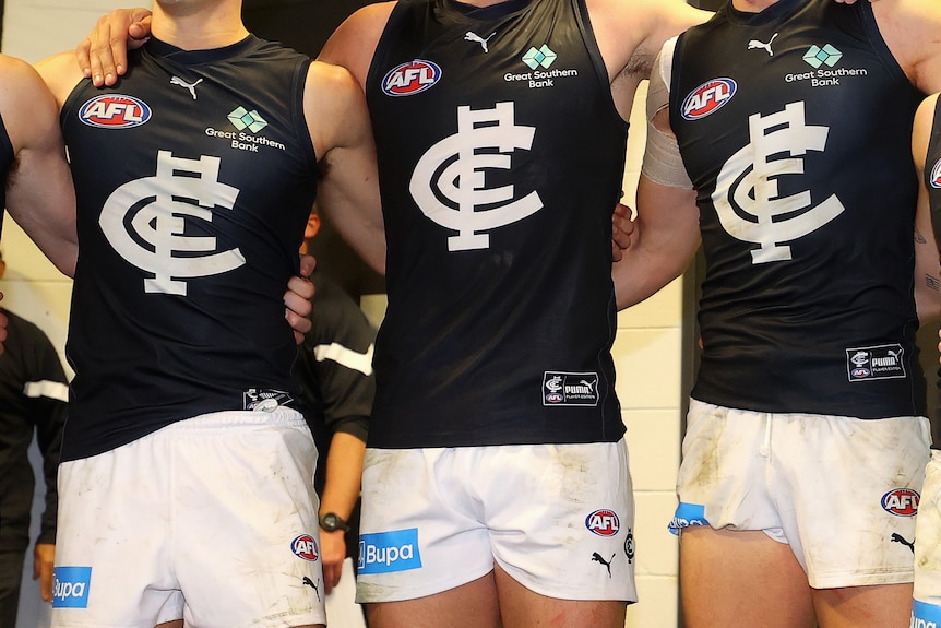 Tight crop generic image of unidentified Carlton players standing together