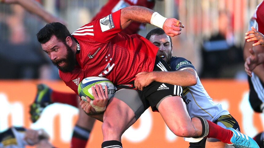 Ryan Crotty makes a break for the Crusaders
