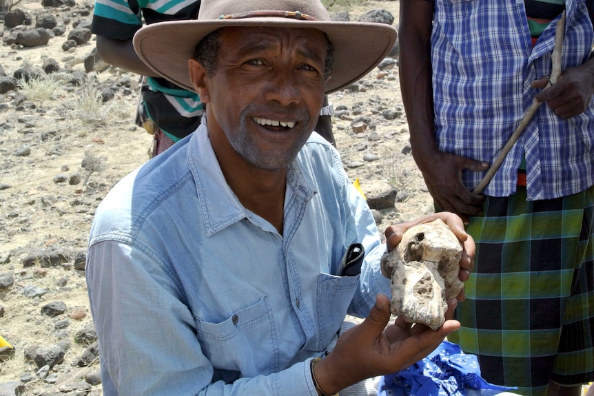 Yohannes Haile-Selassie with fossil skull