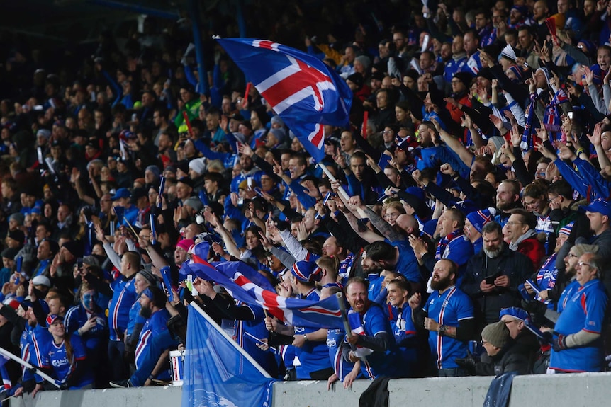 Iceland fans with flags and scarves.
