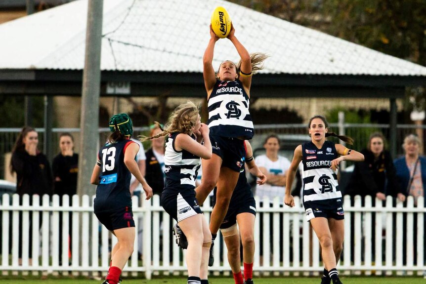 A Panthers player takes a mark during the 2018 SANFL Women's league Grand Final