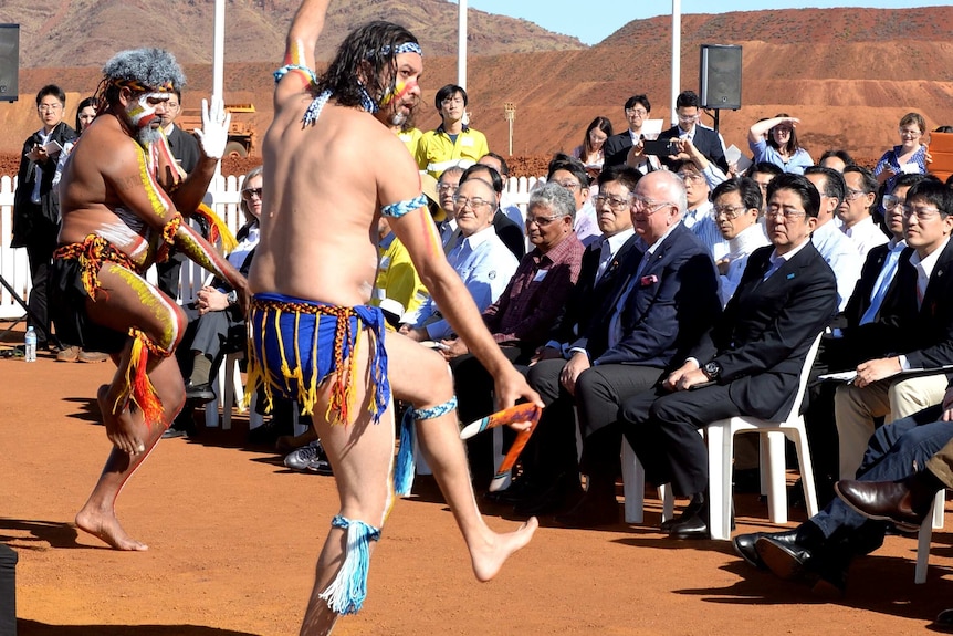 Japanese Prime Minister Shinzo Abe watches Aboriginal dancers.