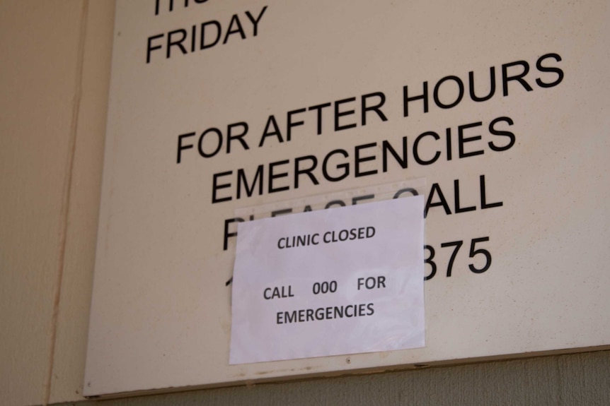 A sign clinic staff put up before they evacuated, instructing patients to contact 000.