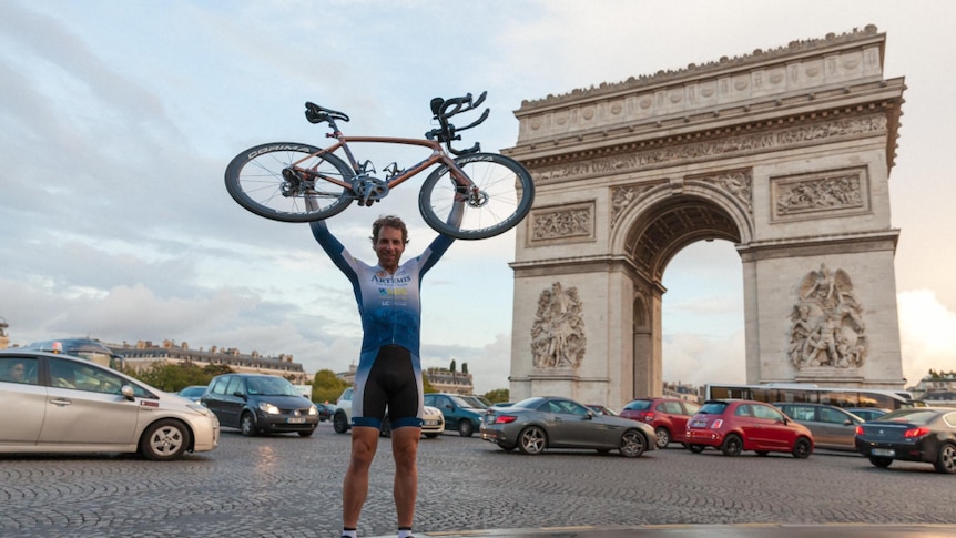 Mark Beaumont poses with his bike after completing his circumnavigation of the globe in under 80 days