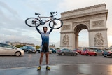 Mark Beaumont poses with his bike after completing his circumnavigation of the globe in under 80 days