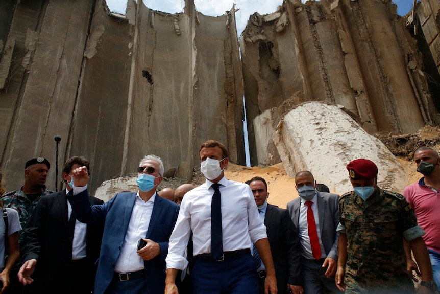 French President Emmanuel Macron visits the devastated site of the explosion at the port of Beirut.