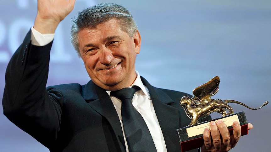 Russian filmmaker Alexander Sokurov accepts his Golden Lion award.