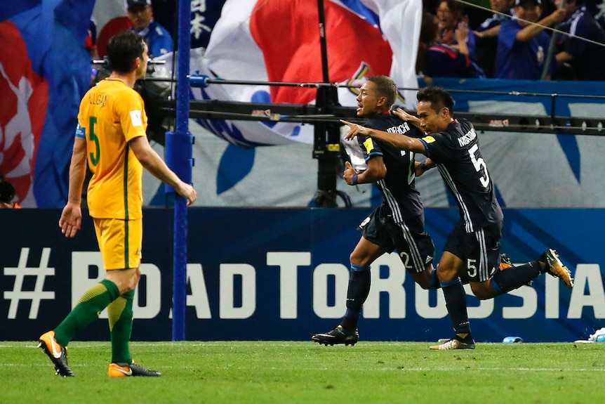 Japan's Ideguchi Yosuke celebrates goal against Socceroos