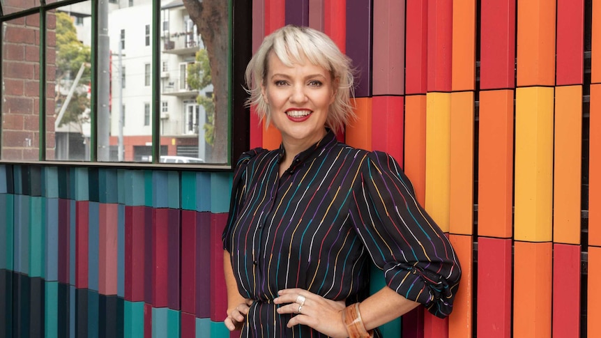 Radio broadcaster and author Jacinta Parsons in a striped jumpsuit in a story about chronic illness impacts on relationships.