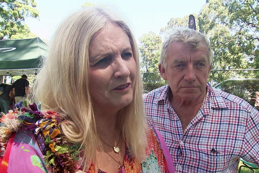 Two people attending Leeton Lee's show about Bunya Nuts at Mount Tamborine.