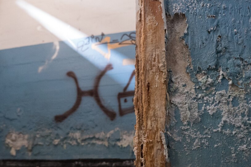 Graffiti and water damage inside the air raid shelter.