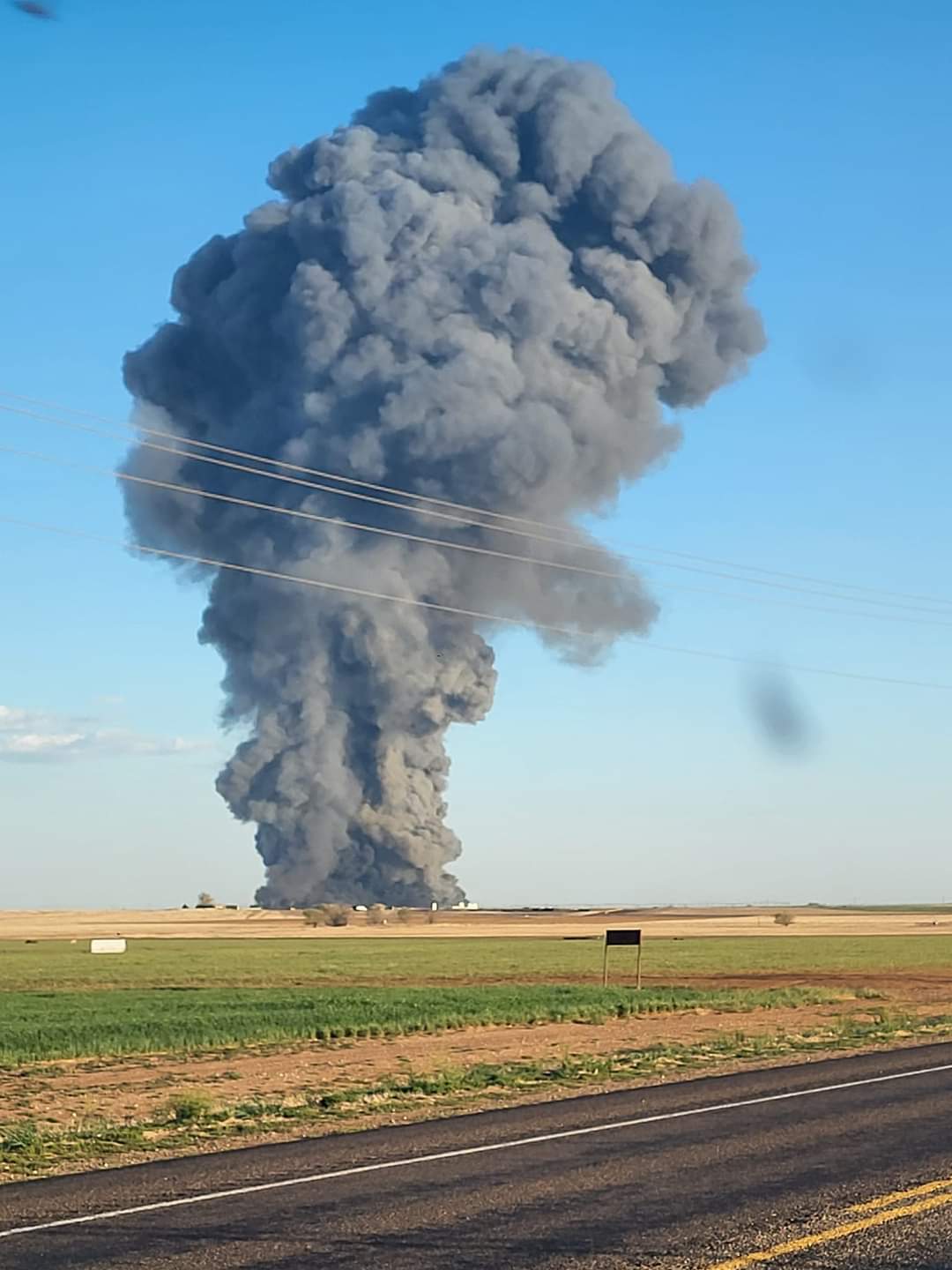 A plume of smoke rises into the sky over Texas following a massive explosion at a dairy farm. 
