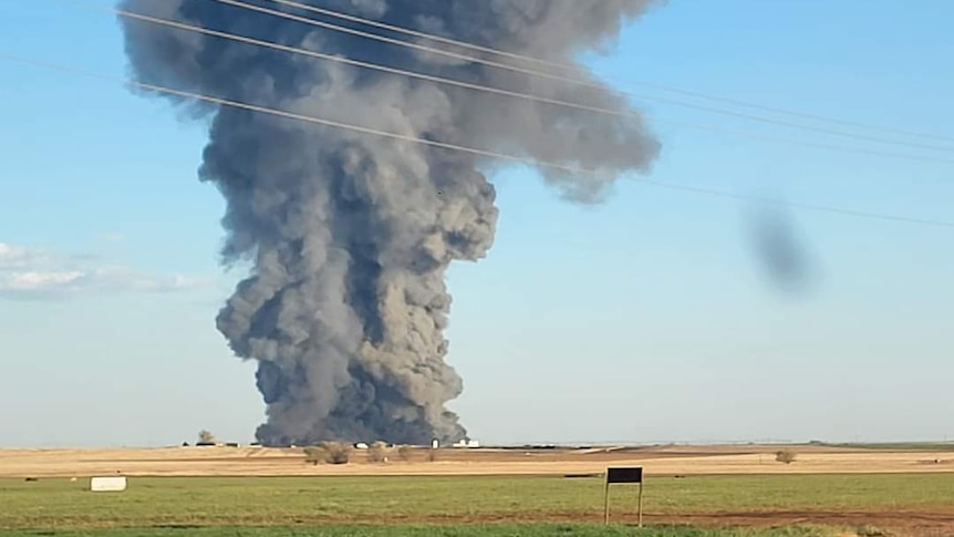 A plume of smoke rises into the sky over Texas following a massive explosion at a dairy farm. 