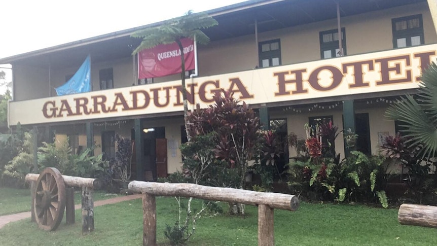 The Garradunga Hotel with a Queenslander banner hanging on the balcony.