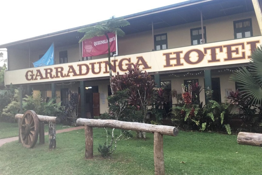 The Garradunga Hotel with a Queenslander banner hanging on the balcony.