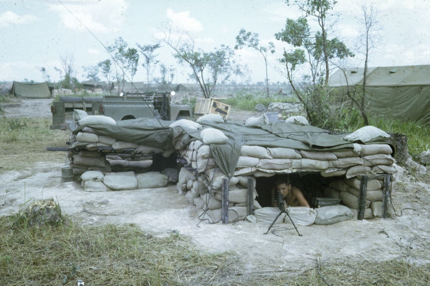 An Australian soldier mans a machine at Fire Support Base Coral during the Vietnam War.