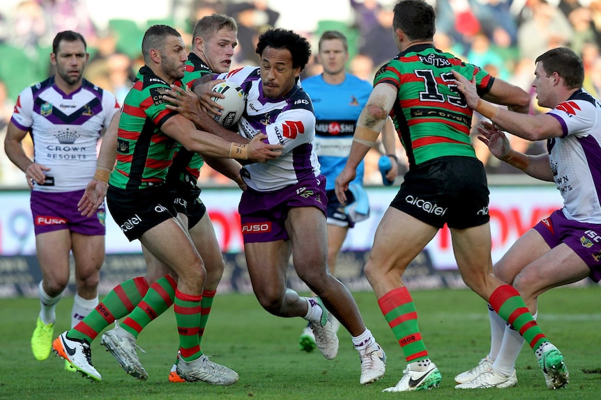 Melbourne Storm's Felise Kaufusi barges into the Rabbitohs defence