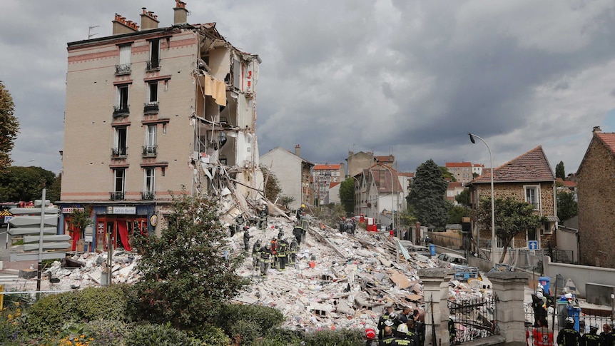 Rescue crews search rubble of collapsed building